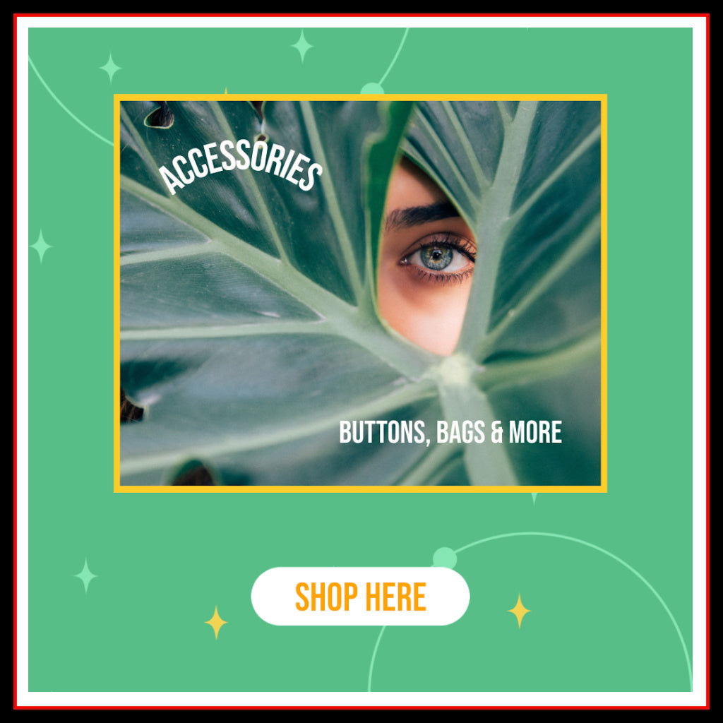 Photo of a woman peeking through a green leaf and text which reads: "Accessories" "Buttons, Bags & More" and "Shop Here"