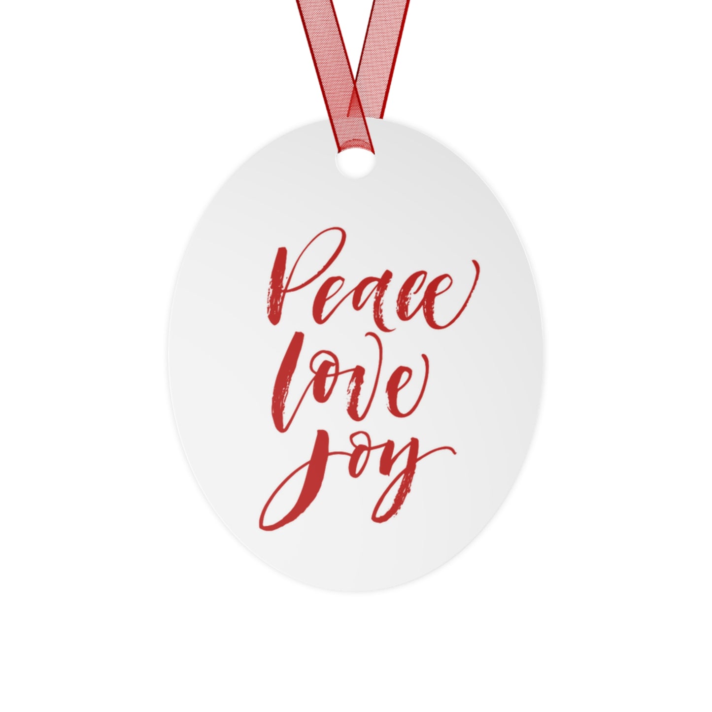 The Holiday-Text Metal Ornament from Printify, featuring red text reading "Peace Love Joy" on a white oval design complete with a red hanging ribbon, makes the perfect Christmas tree decoration. This charming holiday decor piece beautifully captures the spirit of the season.