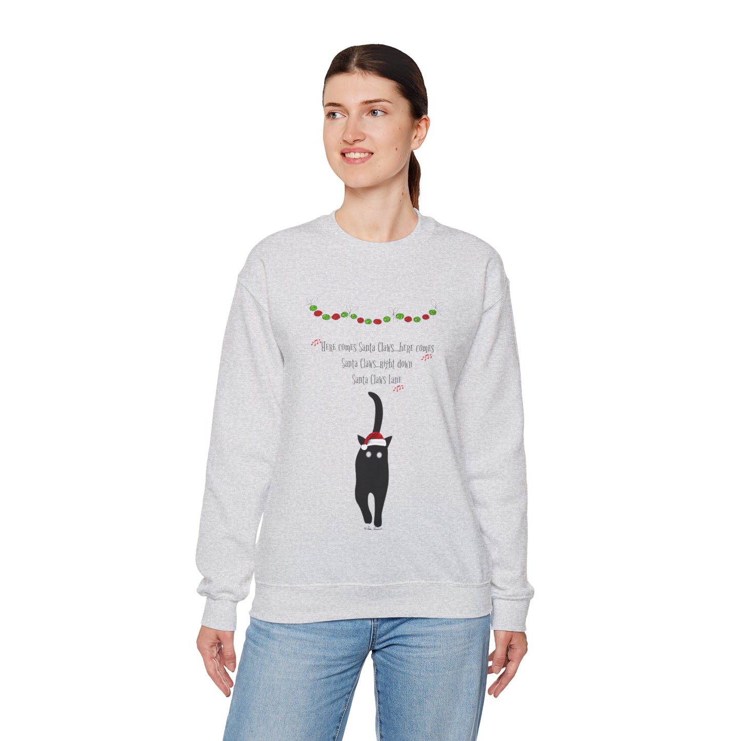 Crafted from a cozy medium-heavy fabric, the Printify Santa Claws Sweatshirt captures the spirit of the holiday season. This unisex garment in a light gray shade highlights a festive design featuring a black cat and decorative elements around the neckline, making it ideal for staying warm and fashionable.