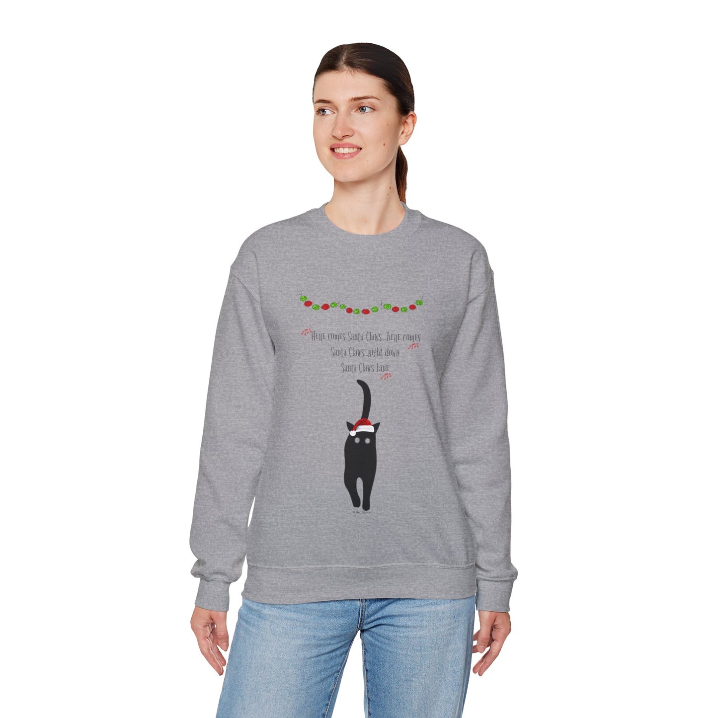 A person stands against a white background, wearing a cozy medium-heavy fabric gray sweatshirt by Printify. The unisex "Santa Claws Sweatshirt" features a black cat and playful festive text, perfectly capturing the holiday season spirit.