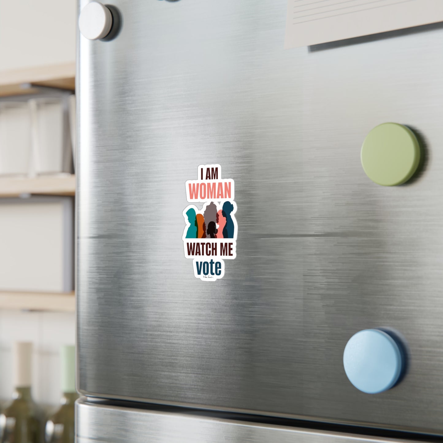 A Printify stainless steel refrigerator door with a removable adhesive Voting Women's Decal that says "i am woman watch me vote" and silhouettes of two women.