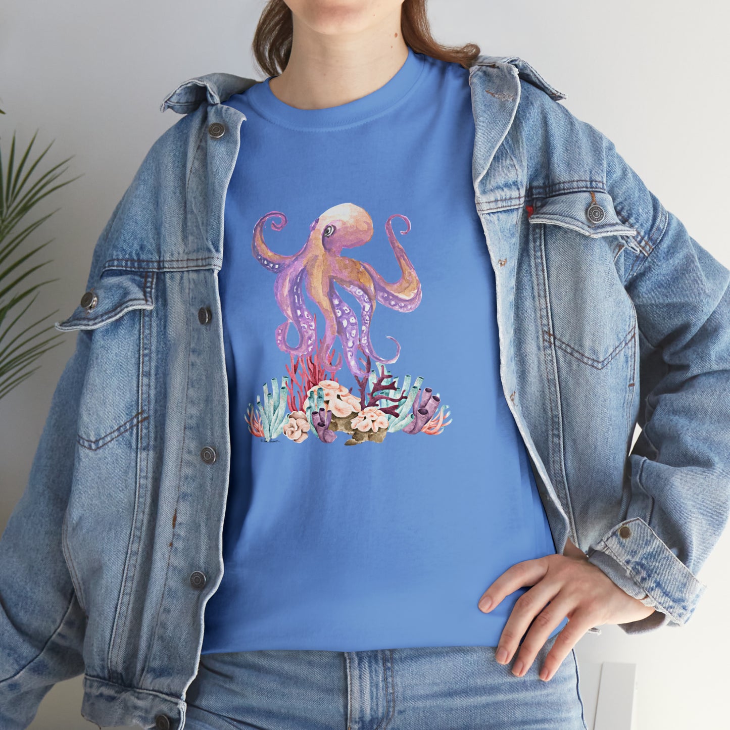 Mock up of a woman wearing the Carolina Blue shirt under a denim jacket