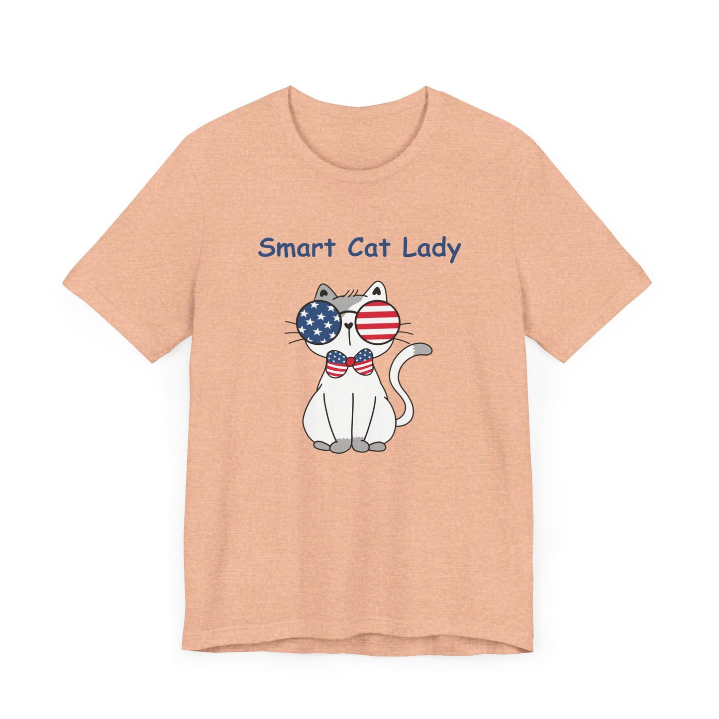 The Unisex Smart Cat-Lady T-shirt from Printify features a cartoon cat with glasses boasting American flag lenses and a bow tie, with the text "Smart Cat Lady" above it. This patriotic design is available in 4 colors and printed on a high-quality cotton Bella+Canvas garment.