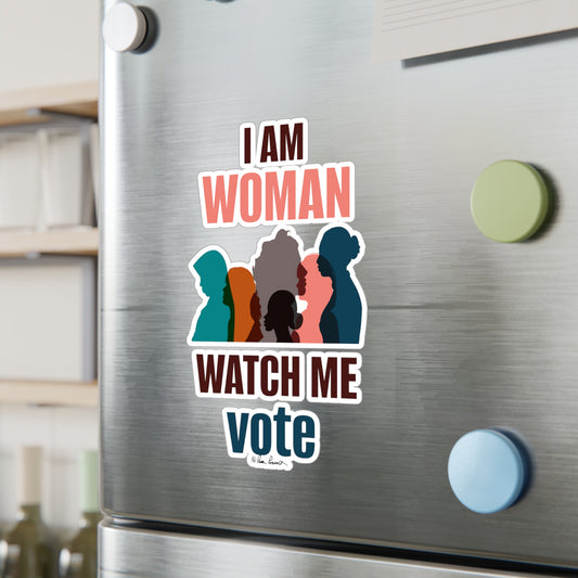 A stainless steel refrigerator door adorned with a magnet featuring Voting Women's Decals by Printify, featuring colorful silhouettes of women and the text "i am woman watch me vote," printed on white vinyl.