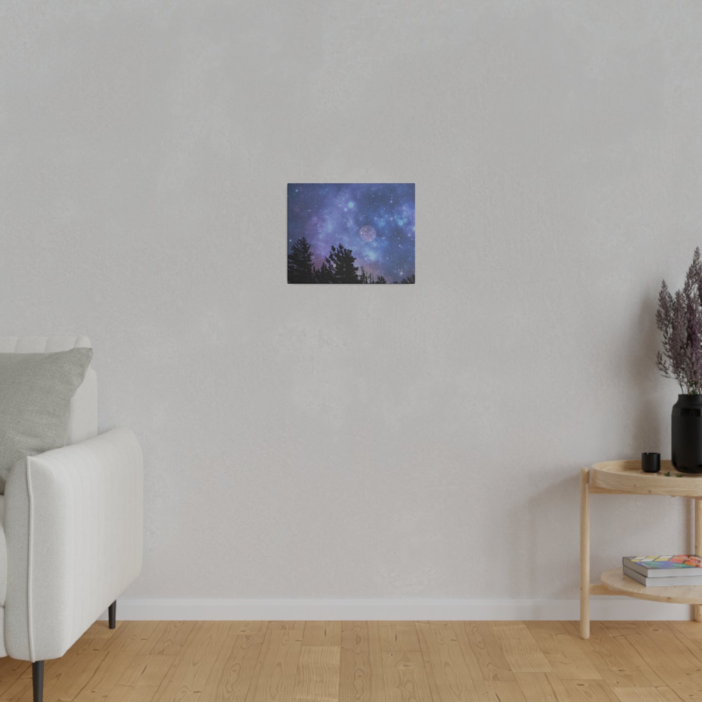 A starry night sky Printify Blue-Moon Matte Canvas hangs on a blank wall in a room with simple decor, encapsulated by a radial pine frame from renewable forests.