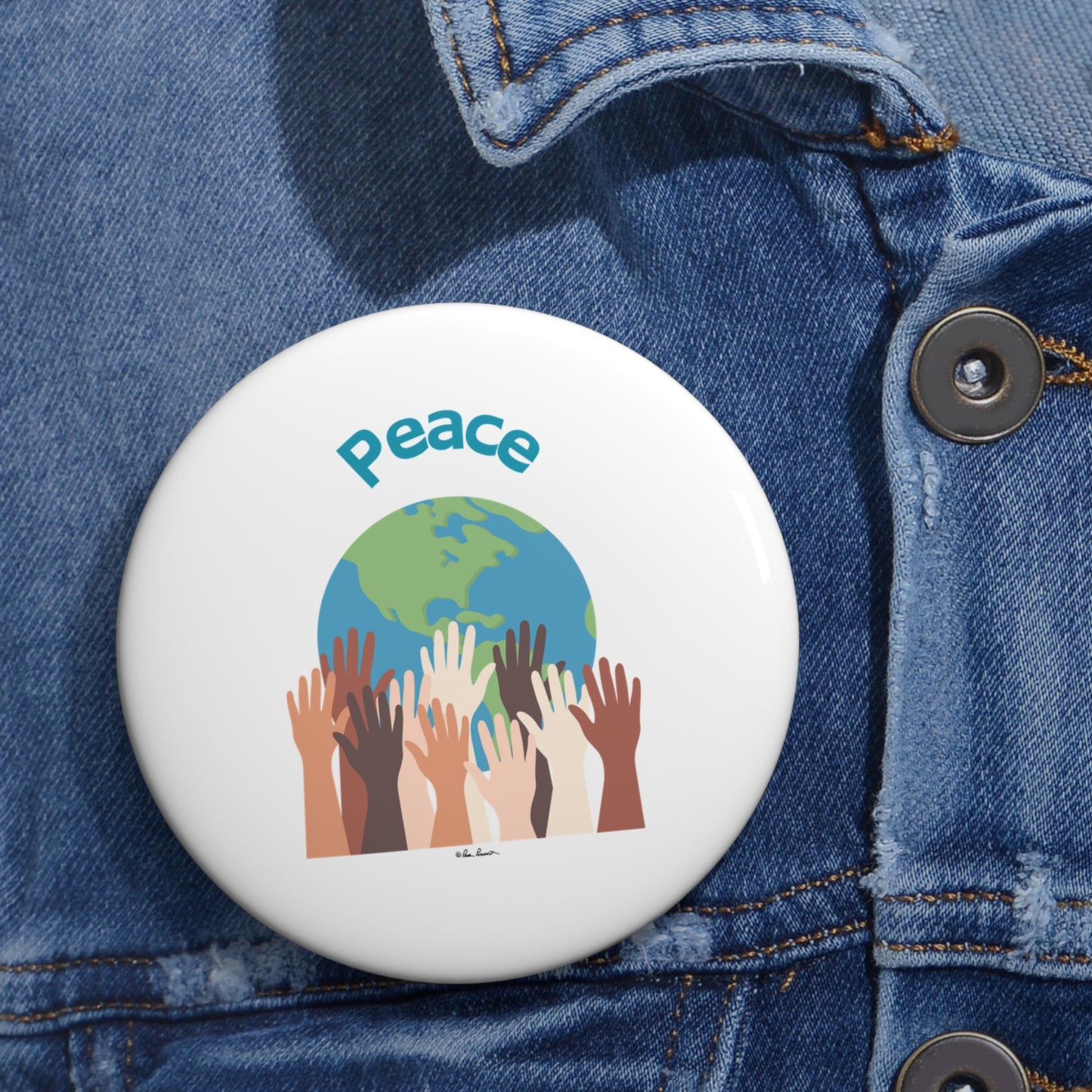 A round button from Printify, made in America, features "Peace" written above an illustration of multicolored hands reaching towards a globe. Pinned to a denim jacket, this unisex World-Peace accessory beautifully complements any outfit and embodies the spirit of global harmony. Available in 3 sizes and made of lightweight metal, it’s a perfect stylish addition.
