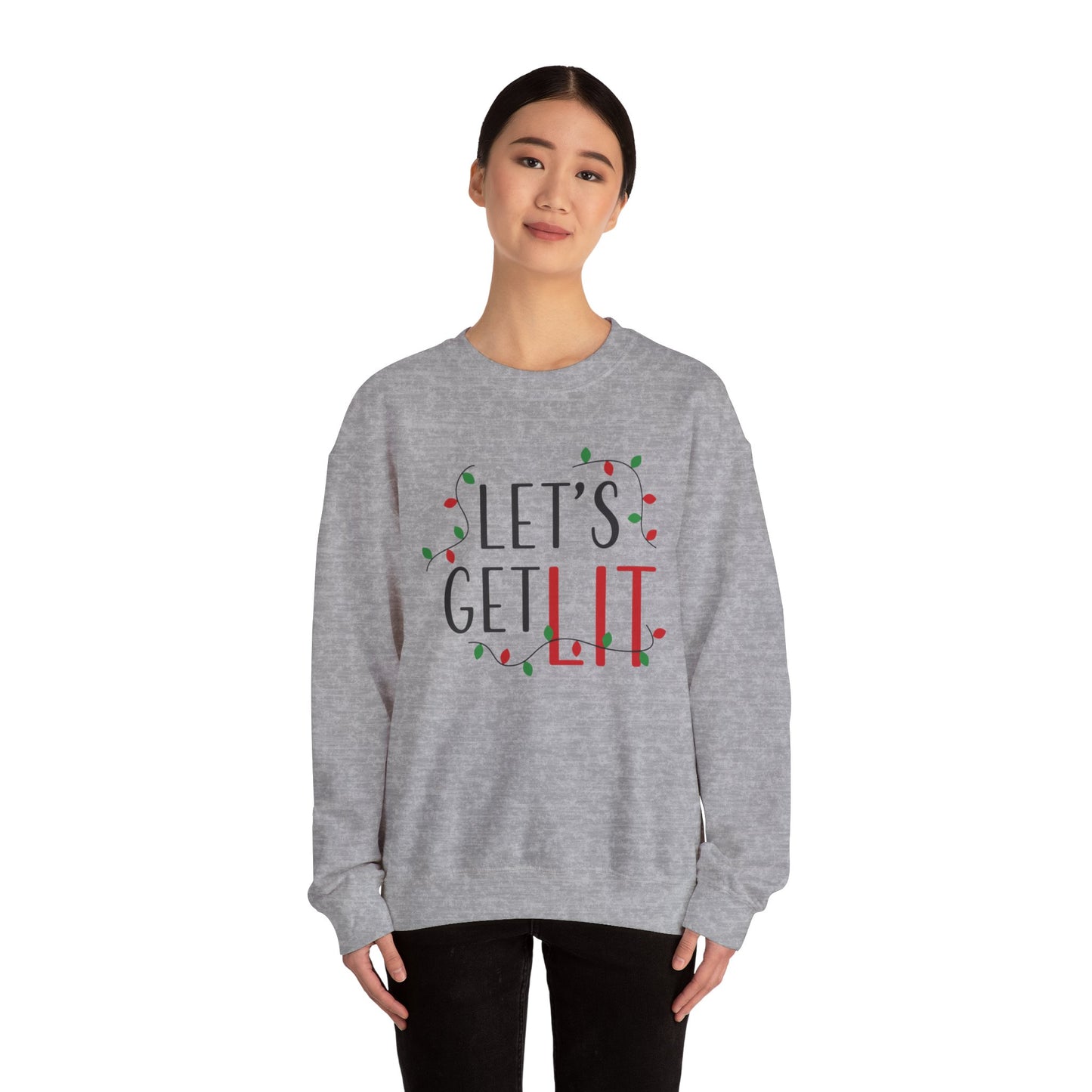 The individual is sporting a medium-heavy fabric blend Holiday Unisex Sweatshirt by Printify, an American-made Gildan brand item showcasing the text "LET'S GET LIT" accented with festive holiday lights.