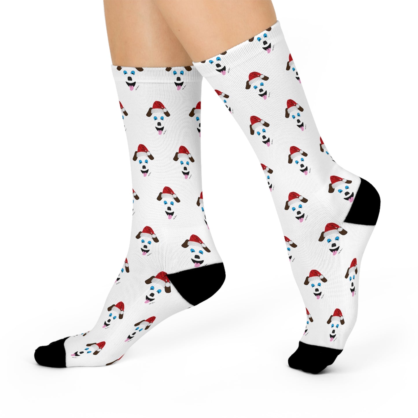 An individual wearing the Festive Santa-Dog Crew-Socks by Printify, featuring a playful design of dogs donning red bandanas and glasses, ideal for holiday festivities. These unisex socks are perfect for dog enthusiasts and include stylish black accents on the toes and heels.