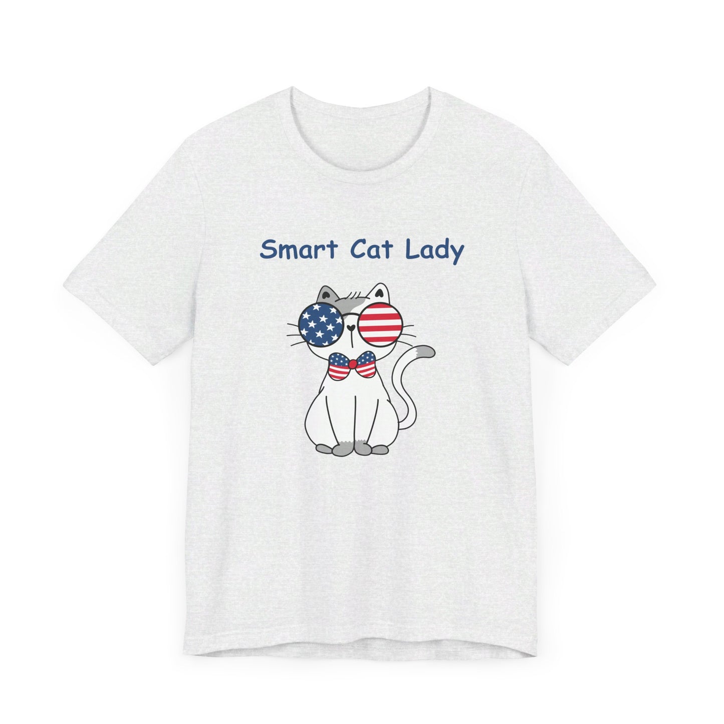 The Unisex Smart Cat-Lady T-shirt by Printify is a white tee made of cotton, featuring a cartoon cat sporting a bow tie and American flag sunglasses. Above the patriotic cat, the text reads "Smart Cat Lady.