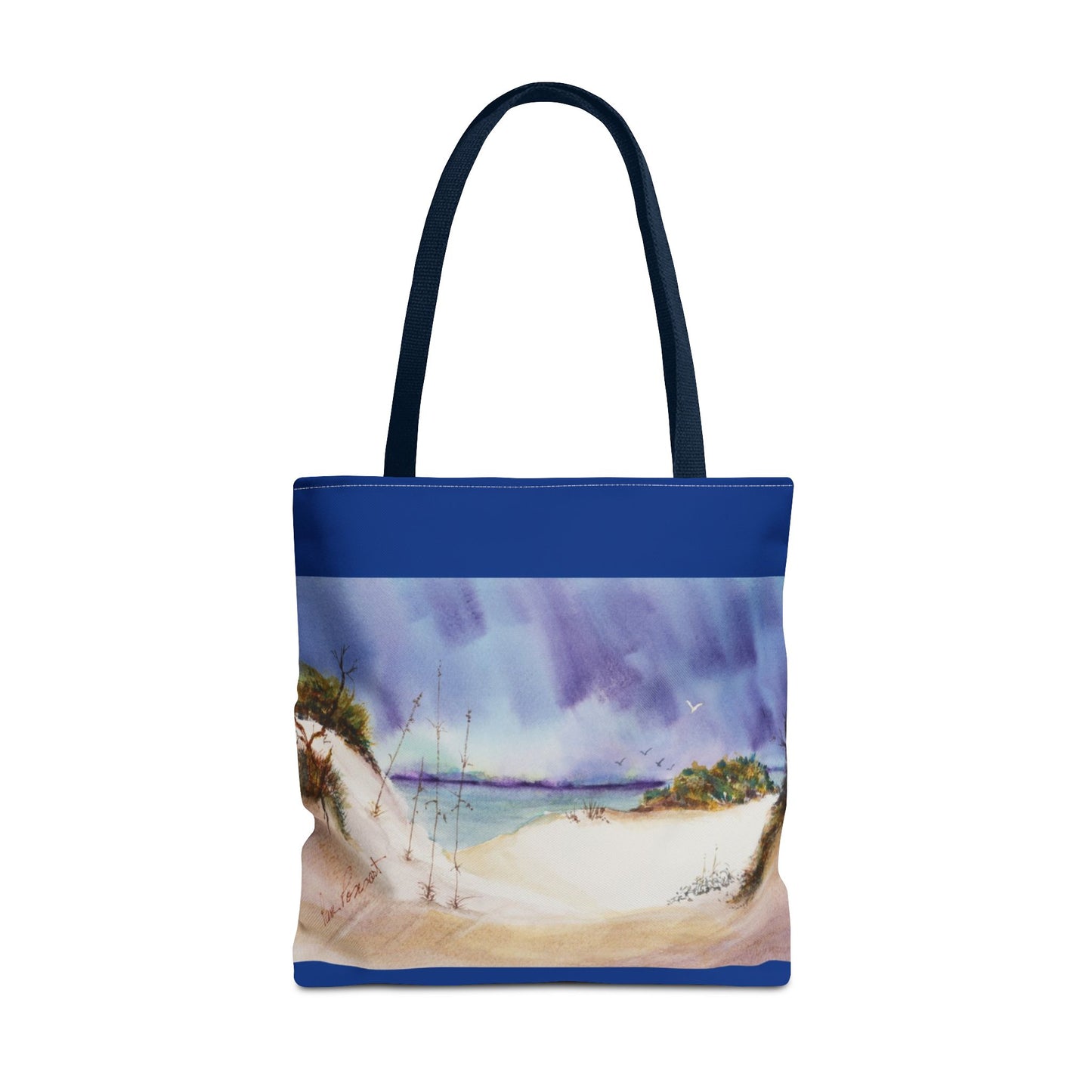 Printify's Seaside Tote Bag, available in 3 sizes with a polyester, 2-sided print, displays a captivating beach landscape featuring sandy dunes, sparse vegetation, and a serene sea beneath cloudy skies. Ideal for summer adventures and beach outings.