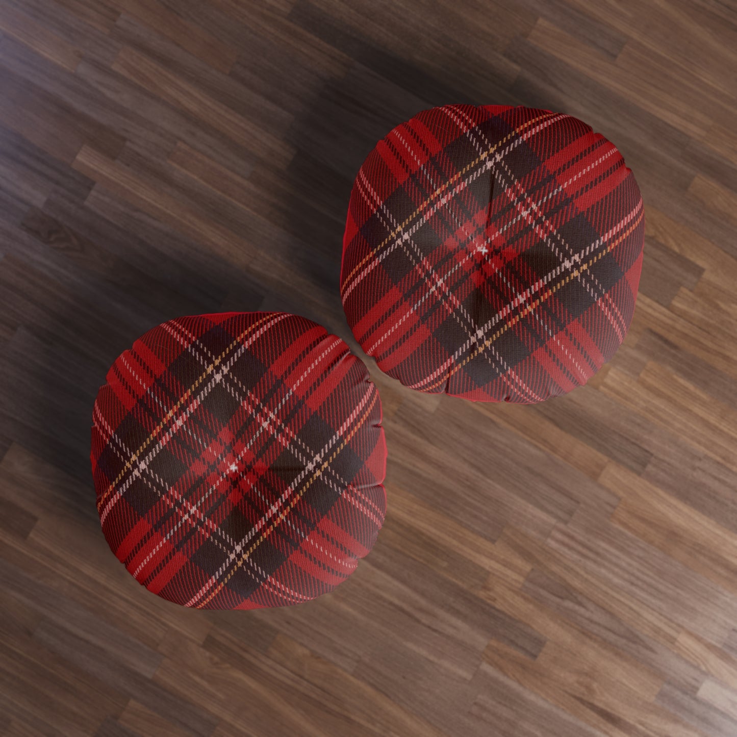 Two comfortable Printify plaid tufted floor pillows on a wooden floor.