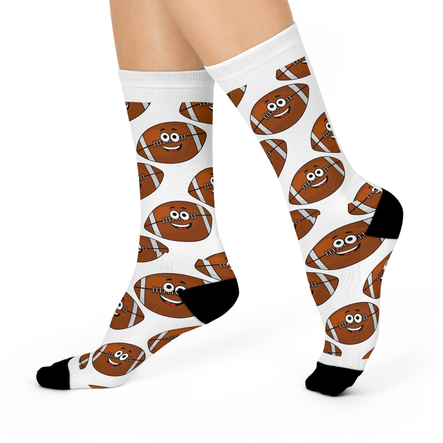 A Football-Lover is showcasing a pair of white socks featuring a cartoon football design with black accents. These Printify Funny-Football Cushioned Crew-Socks: Unisex; Game Day Gift bring humor to the ensemble, making them ideal for fans who appreciate vibrant colors and playful style.