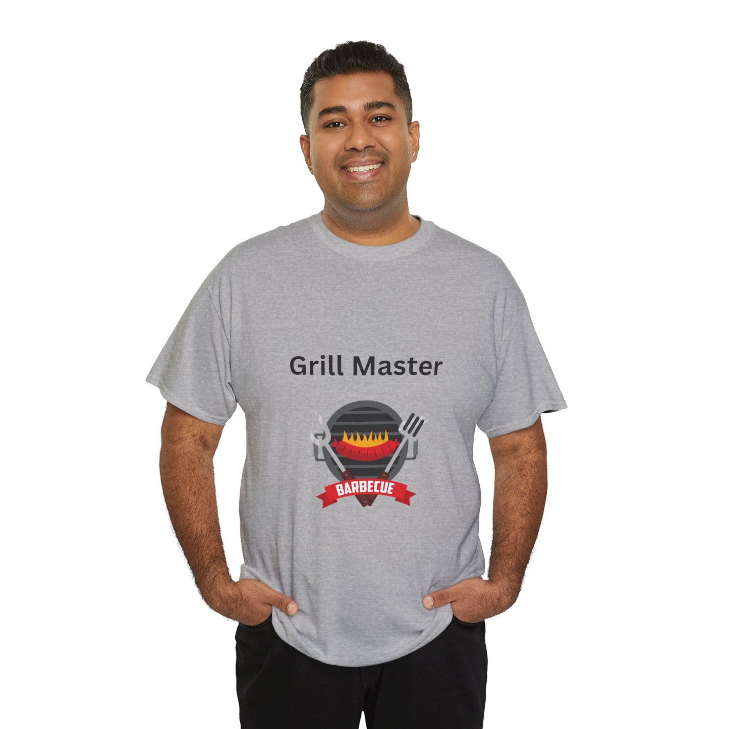 A person wearing a gray Unisex Grill-Master T-shirt: 2 colors; Cotton; Gildan by Printify that says "Grill Master" with a graphic of a barbecue grill and utensils stands against a white background. This unisex shirt is proudly made in America.