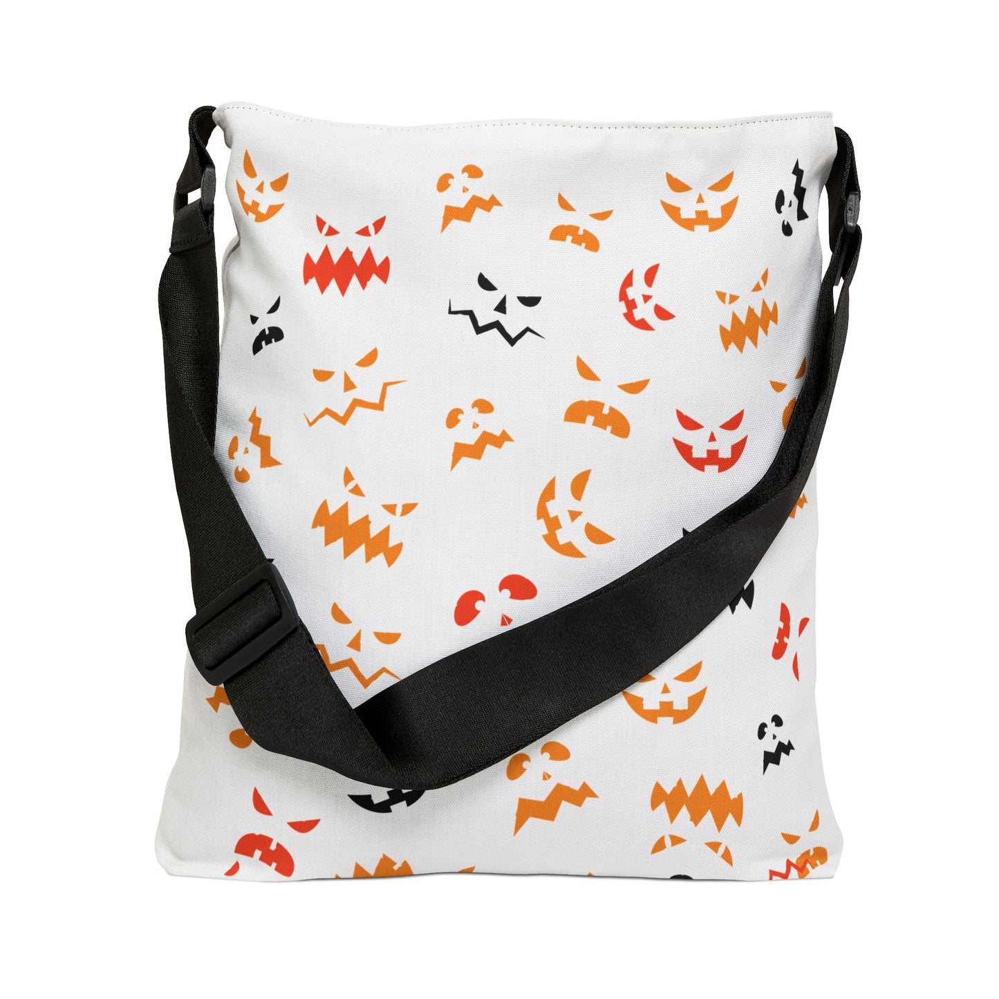 The Printify Halloween Adjustable Tote Bag: Spooky Trick or Treat sack features a black adjustable strap and an all-over pattern of orange, yellow, and black pumpkin faces—perfect for festive fun.