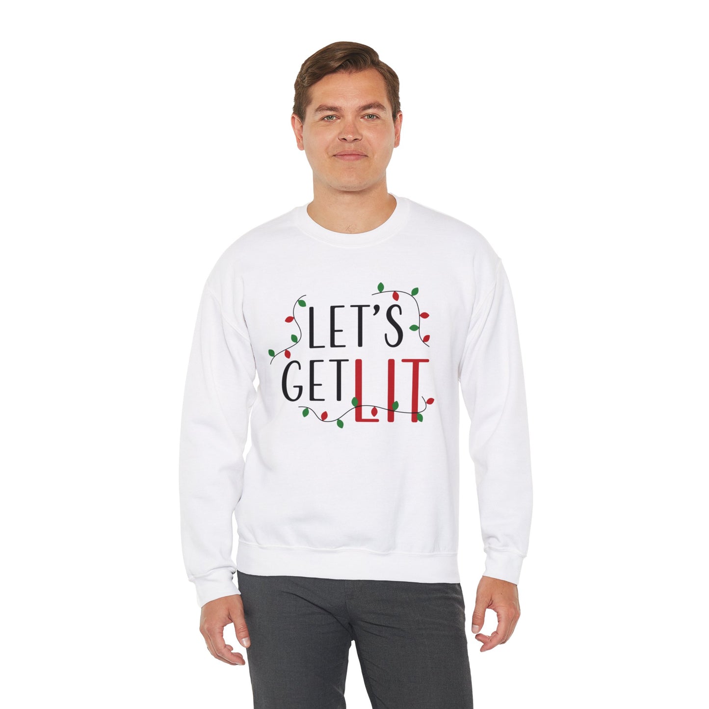A person is wearing a Printify Holiday Unisex Sweatshirt, available in 8 sizes and 2 colors under the Gildan brand, crafted from a medium-heavy fabric blend. The sweatshirt features the "Let's Get Lit" and holiday lights graphic and is shown against a plain white background.
