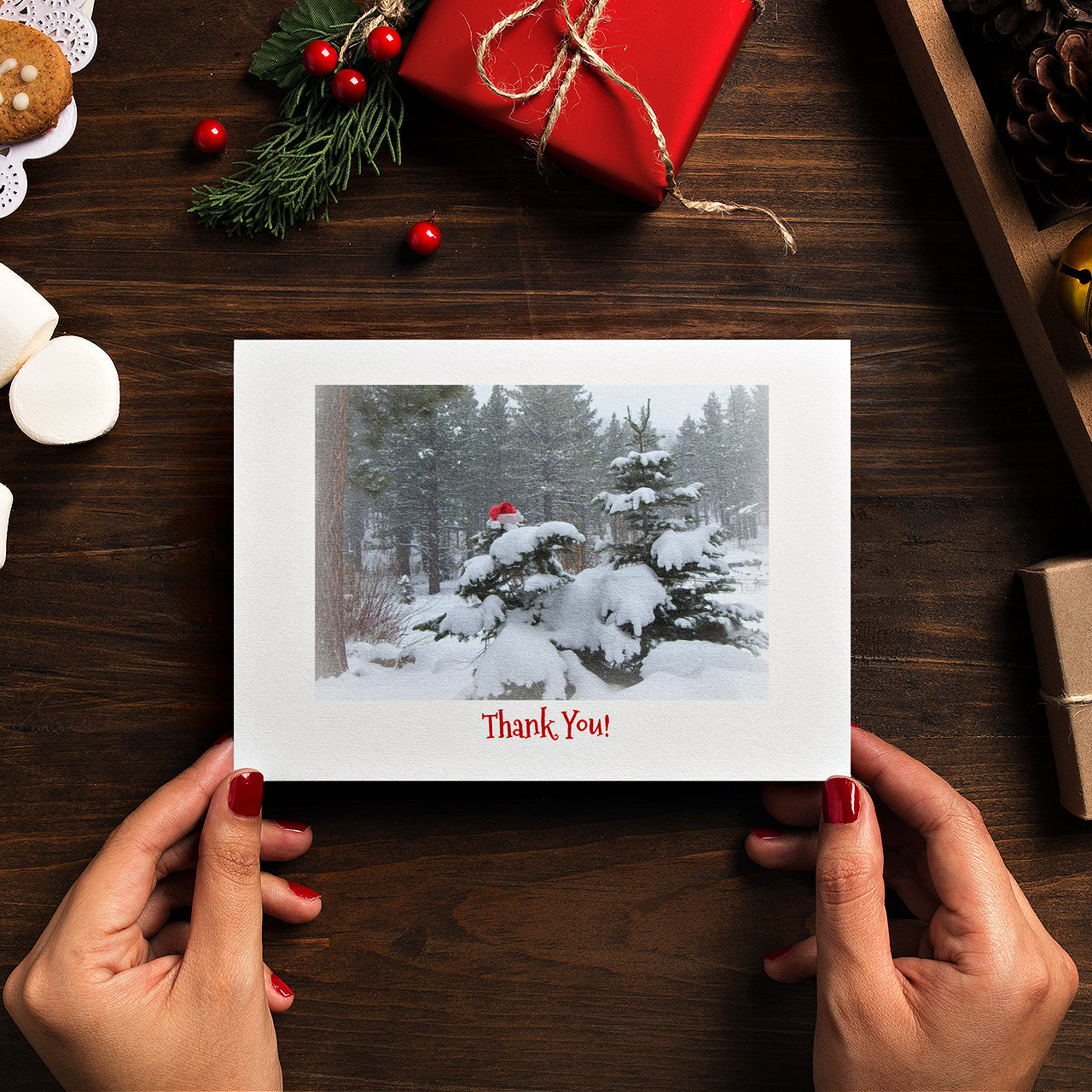 Mock up of person holding the Thank You card
