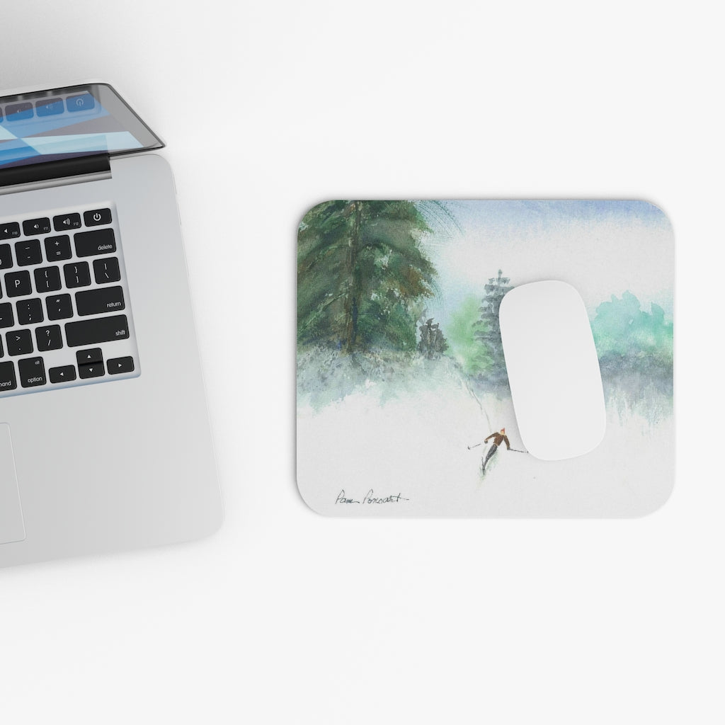 Mock up of our mouse pad next to a computer keyboard