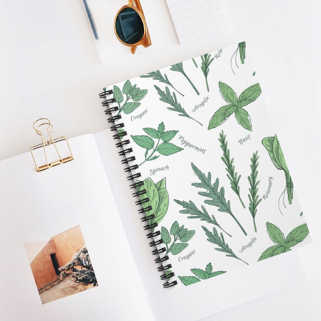 Mock up of our Small Culinary-Kitchen Notebook laying on a table with other items
