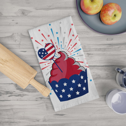 A Printify Decorative Kitchen Towel with a cupcake and a rolling pin, adding a festive touch to your kitchen. The towel is large 28" x 28", made of cotton, and has a patriotic design.