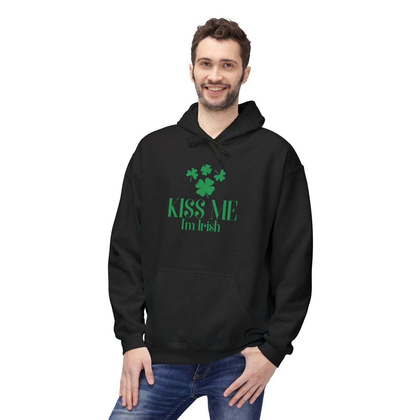 A man wears the Printify Kiss-Me I'm Irish Hoodie: St. Patricks Day Shamrock Pullover, featuring green shamrocks and "Kiss Me I'm Irish" text—ideal for showing Irish pride on St. Patrick's Day.