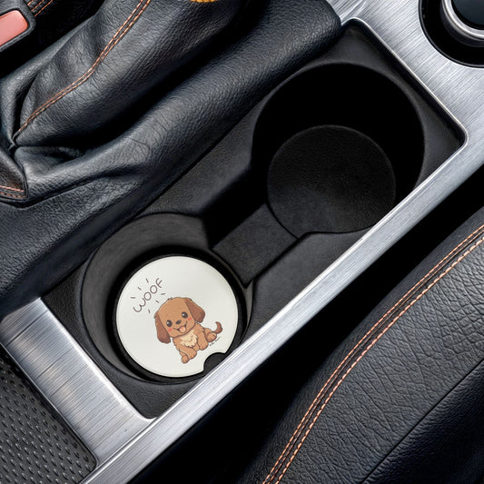 Adorned with a charming illustration of a brown dog accompanied by the word "Woof," this round coaster from Printify makes for an adorable gift. The Cute-Dog Car Coasters are absorbent and fit perfectly in your car's cup holder, surrounded by black leather and stitching details, making it an enchanting addition to any dog lover's car accessories collection.