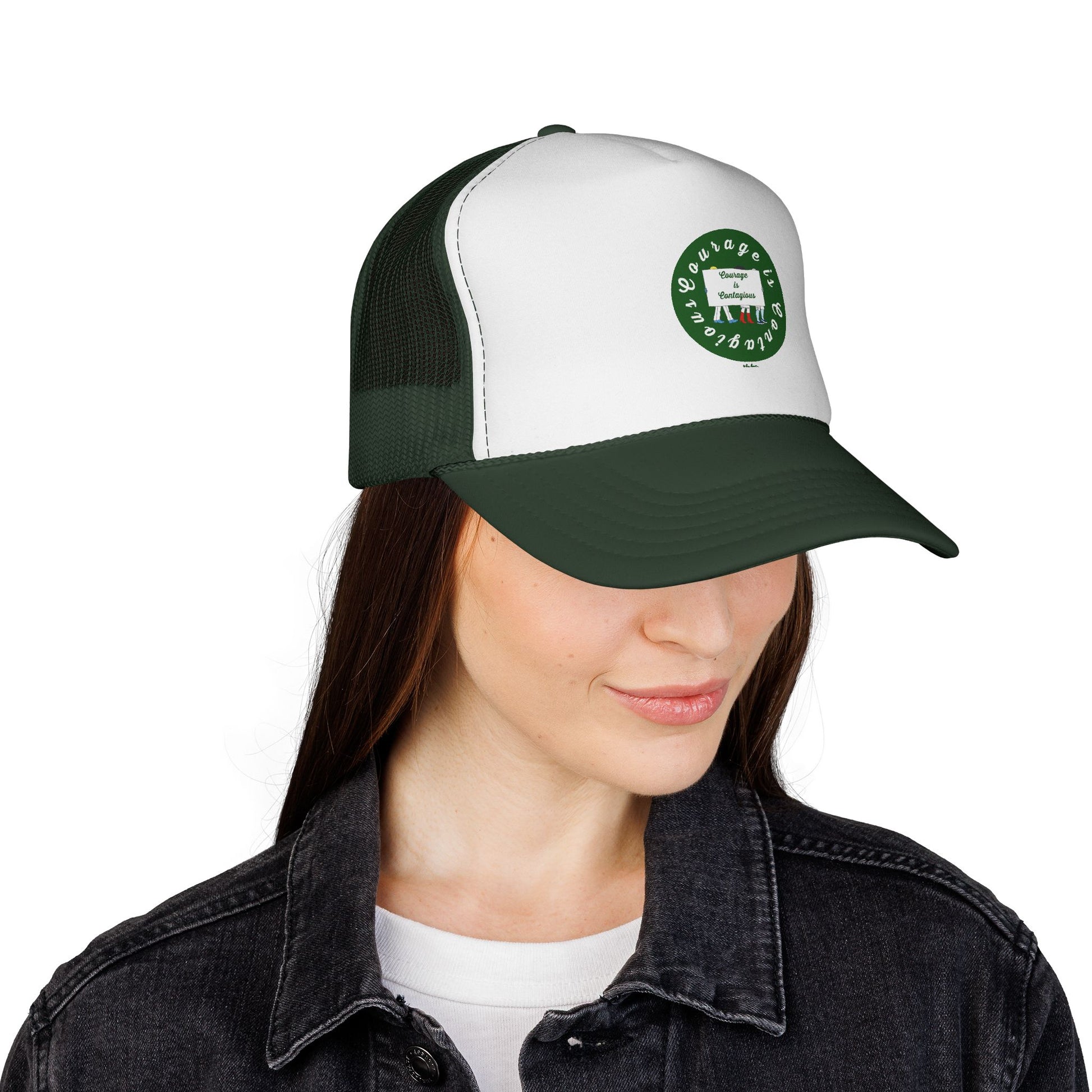 A woman wears a black denim jacket and a Printify Vintage Trucker Hat: Courage is Contagious Logo | Mesh Cap, featuring an adjustable snapback, mesh back, and a circular green cow logo.