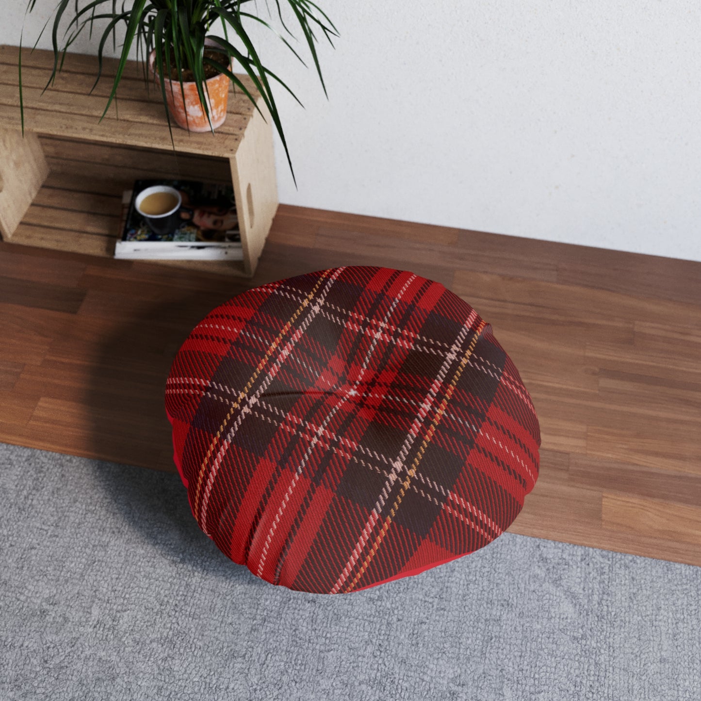 A comfortable red Plaid Tufted Floor-Pillow by Printify in a living room.