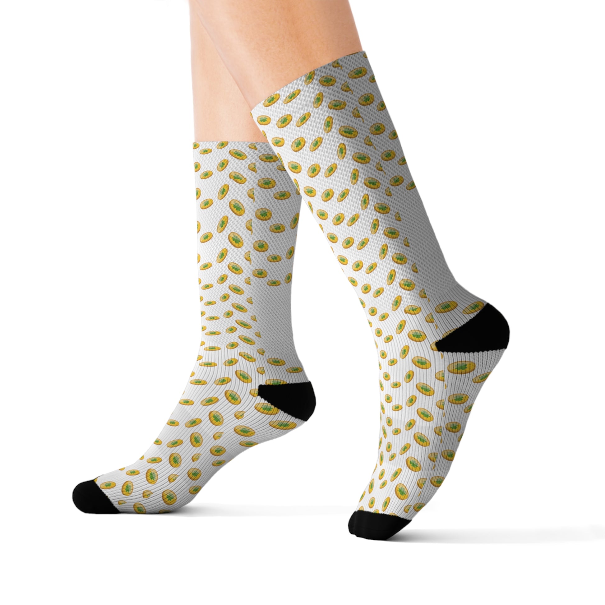 A woman wearing a pair of gold and white polka dot Printify St. Patrick's Day socks.