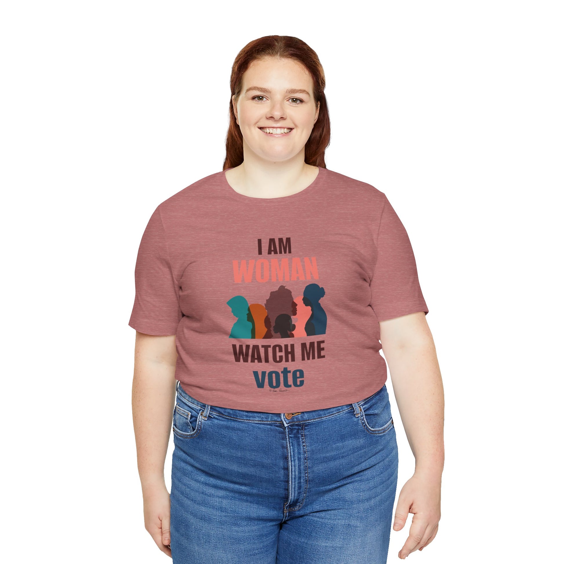 Woman in a red Voting Women's t-shirt by Printify with "i am woman watch me vote" and silhouette graphics, smiling, standing against a white background.