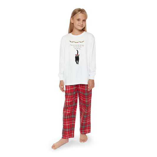 A girl wearing a white cotton t-shirt and Printify's Matching-Family Youth Pajama-set: 2 piece; Unisex; Cotton.