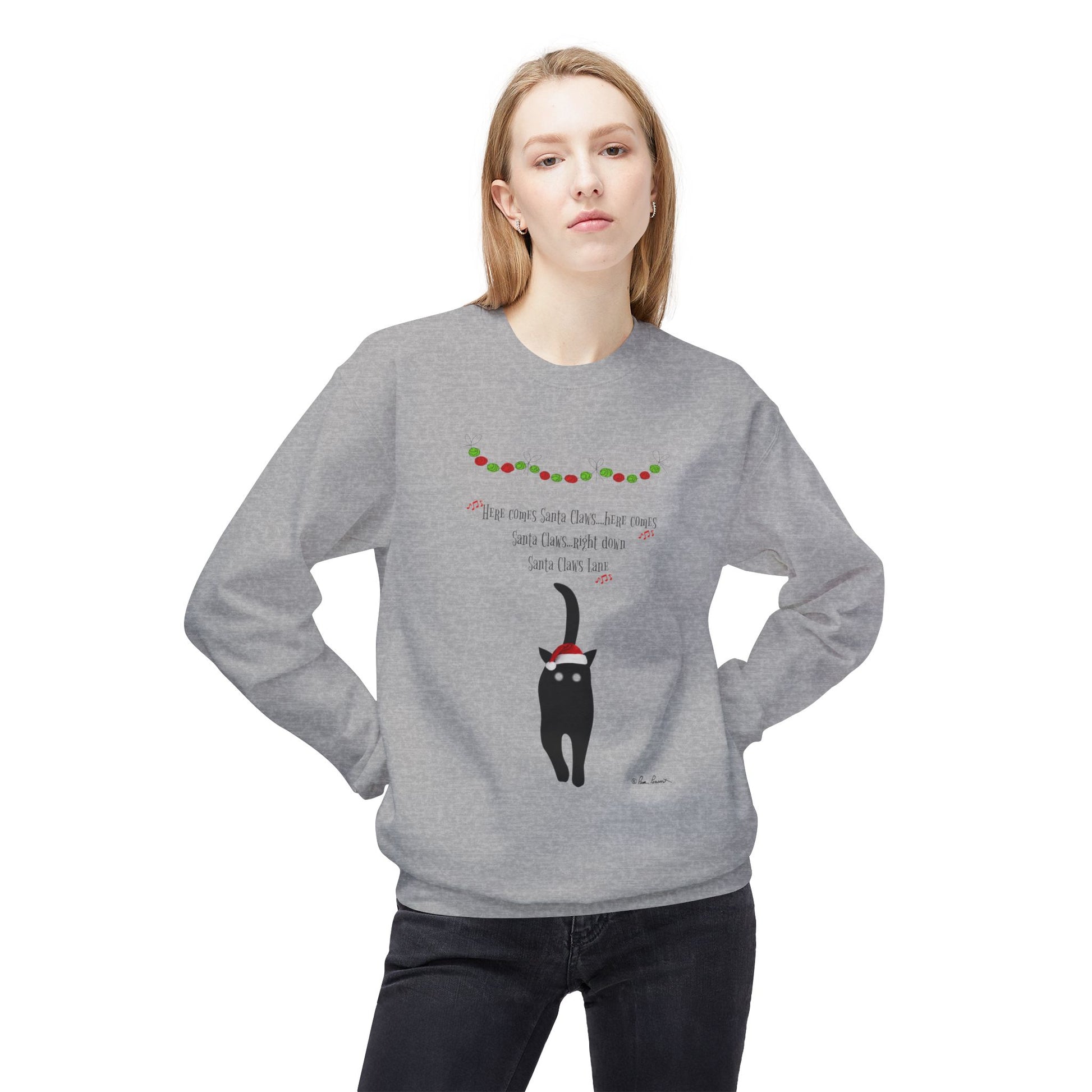 A woman models the Printify Holiday Cat Crewneck Sweatshirt—Unisex, Festive, Playful—with a black cat graphic, holiday lights, and cheerful text, standing against a white background in this cozy pullover.