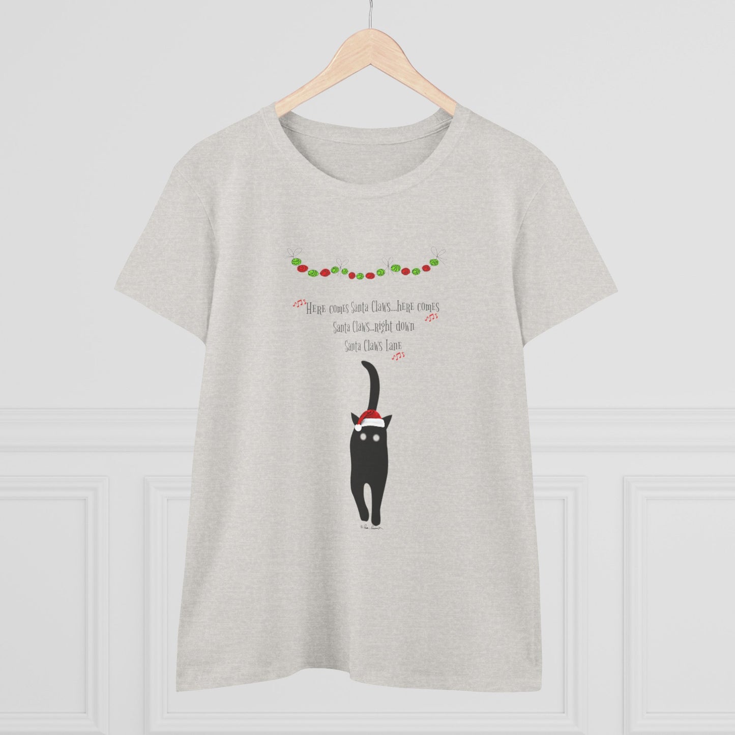 The Santa Claws T-shirt for women by Printify features a playful black cat in a Santa hat with Christmas garland—perfect festive cotton shirt for cat lovers.