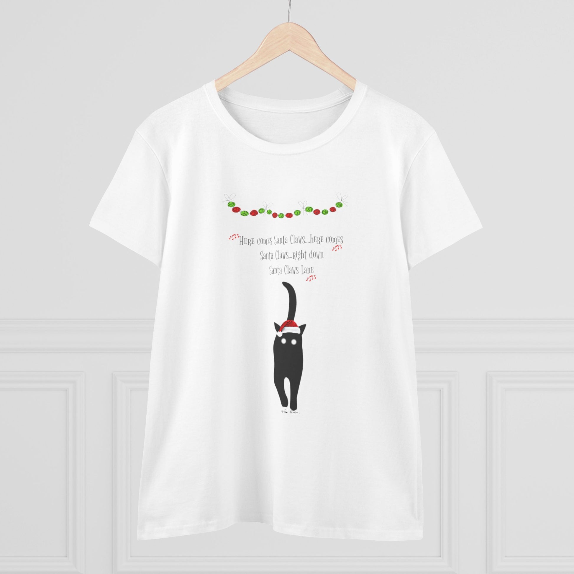 The Santa Claws T-shirt by Printify is a playful women's cotton tee featuring a black cat in a Santa hat with festive decorations and "Here comes Santa Claws..."—perfect holiday wear for any cat lover.