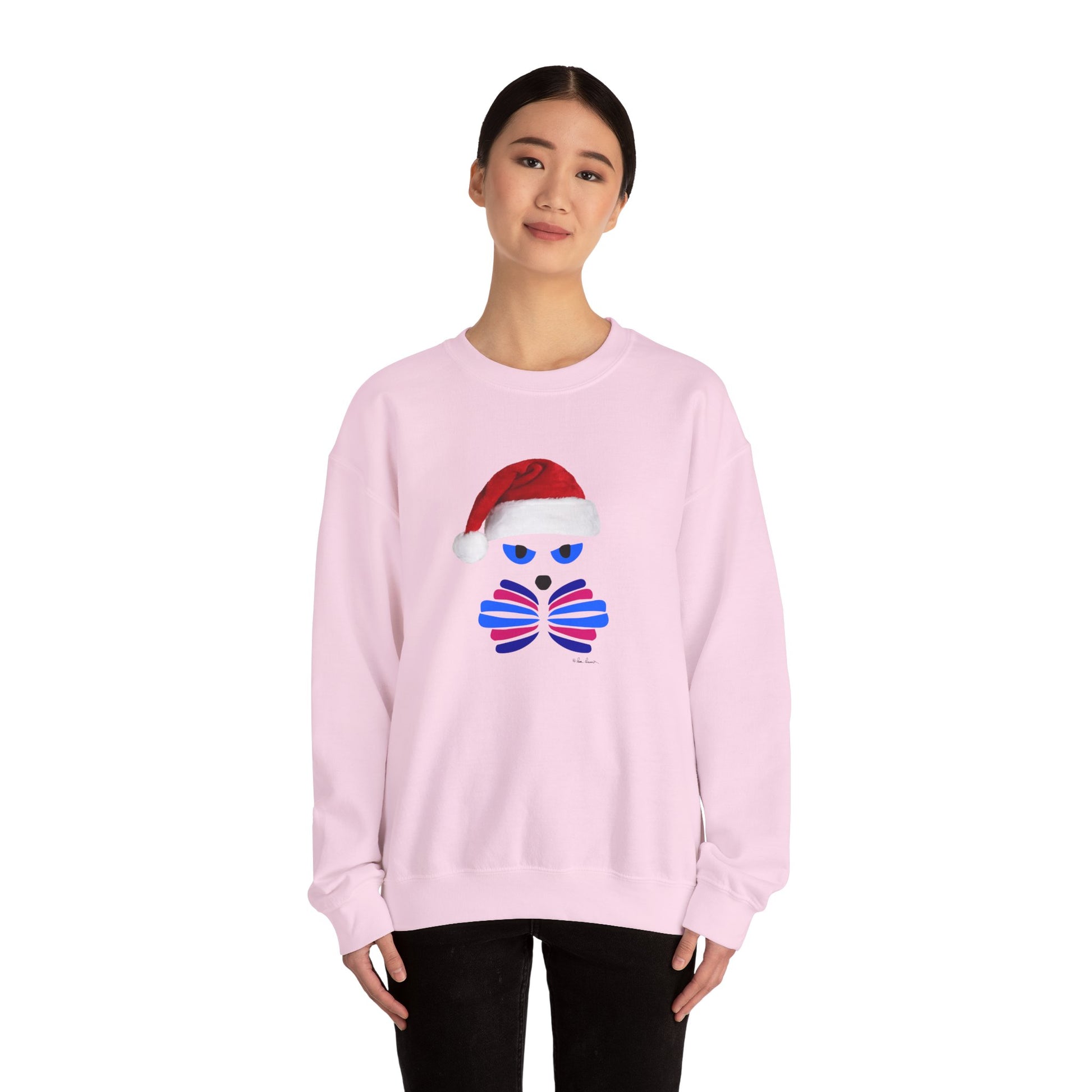 A person wears the Printify Santa Cat Sweatshirt—a unisex, festive crewneck with a cat in a Santa hat graphic—standing against a plain white background.