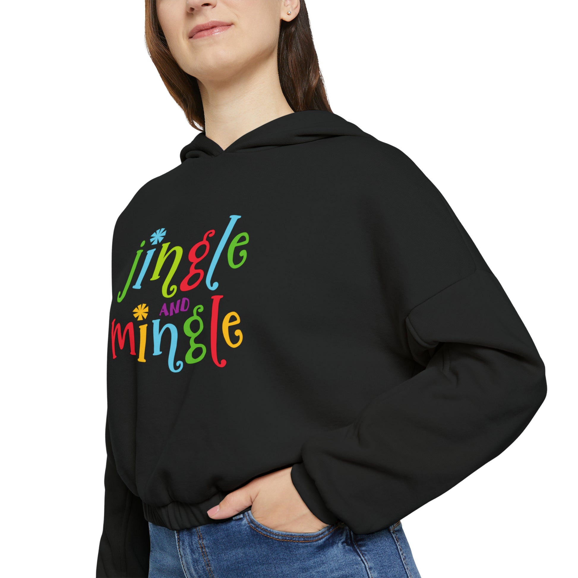 A woman wearing a black Women's Cinched-bottom Hoodie with the word "jingle" in it by Bella + Canvas from Printify.