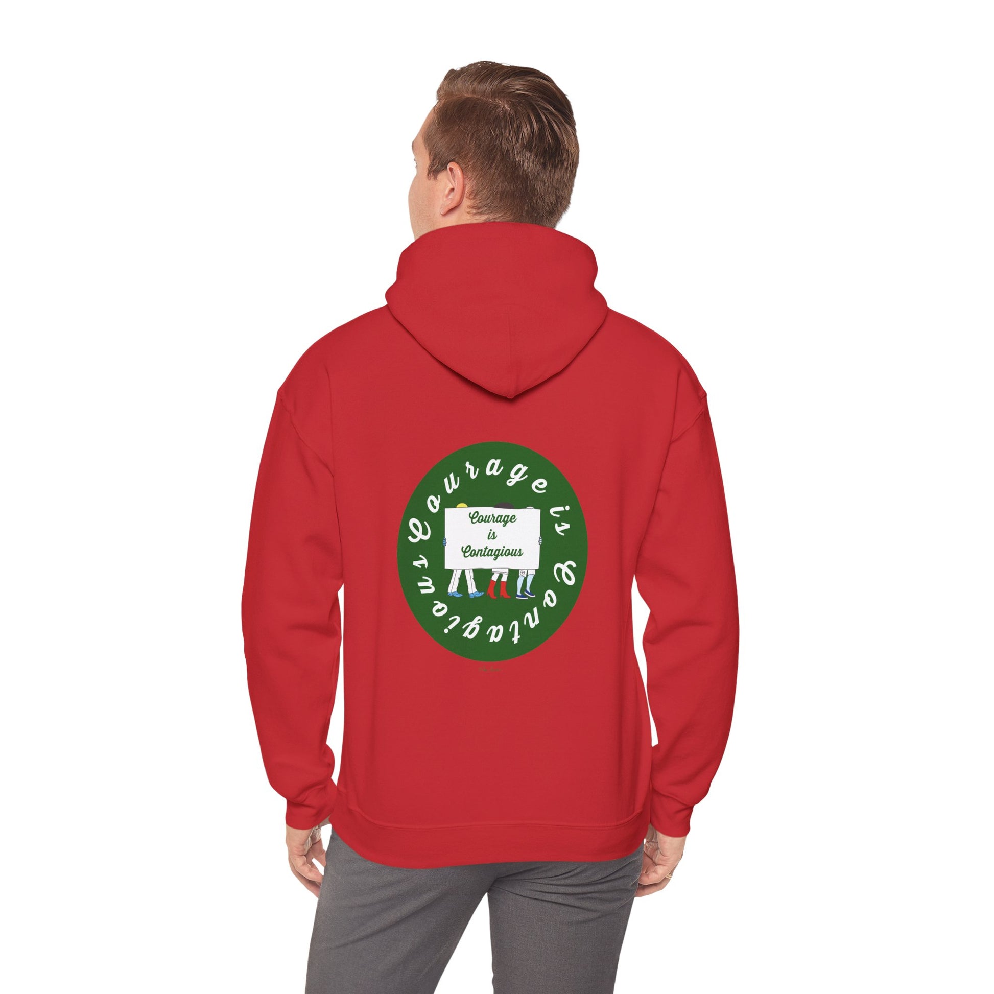 A person wears the Printify Courage Is Contagious Hoodie: Mental Health Awareness, a mid-weight hoodie with a bold green and white circular back design reading "Courage is contagious. Change is contagious.