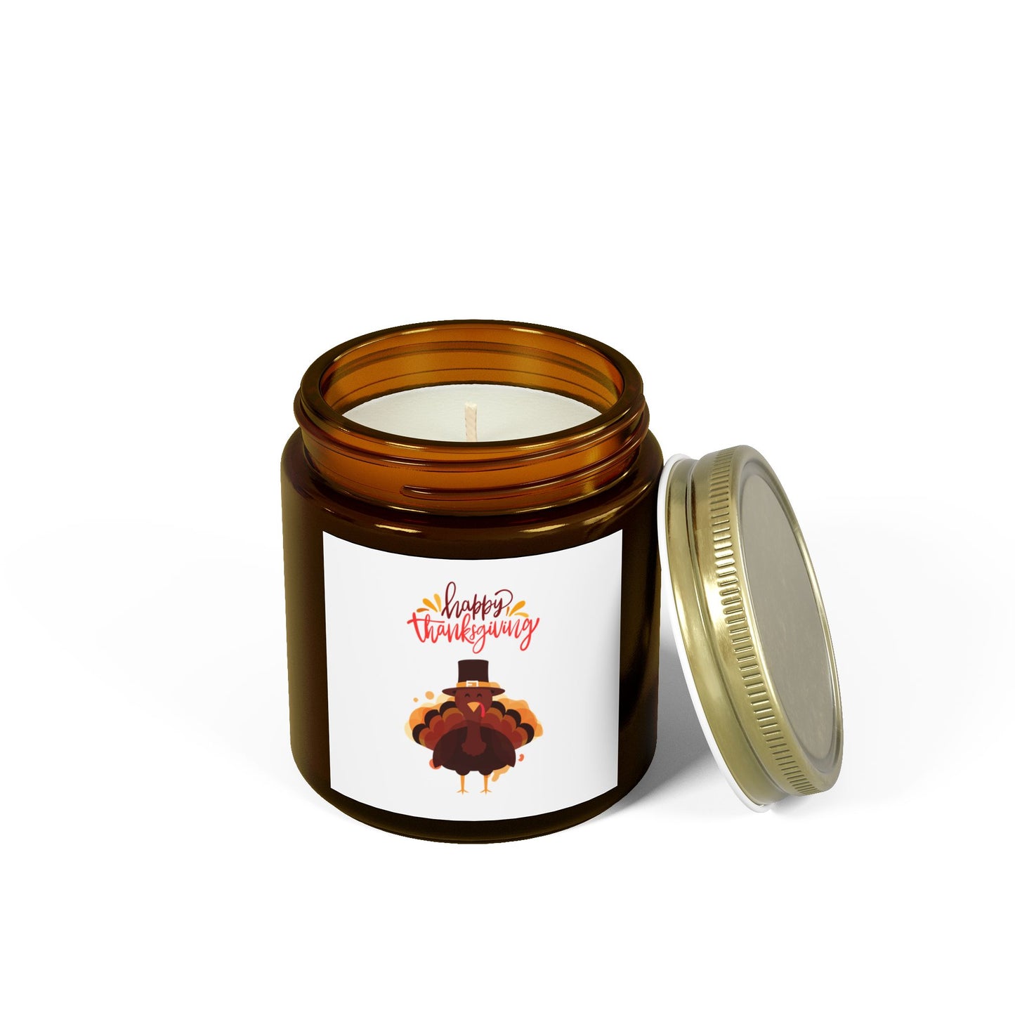 The Printify Thanksgiving Scented Candle features a "Happy Thanksgiving" turkey label on a brown glass jar. Crafted from eco-friendly coconut apricot wax, this 4 oz candle burns for 20 hours. Lid is off and placed beside the jar.