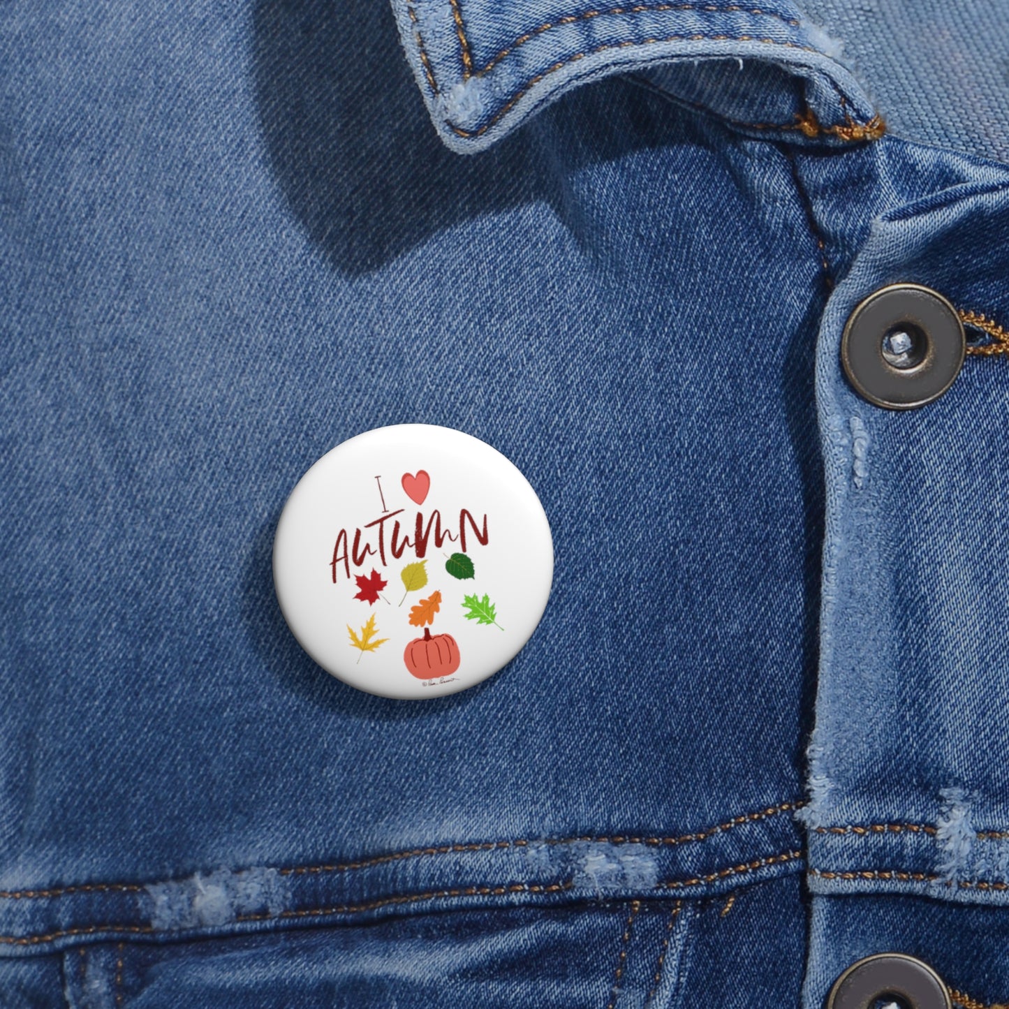 1.25" button on a denim shirt