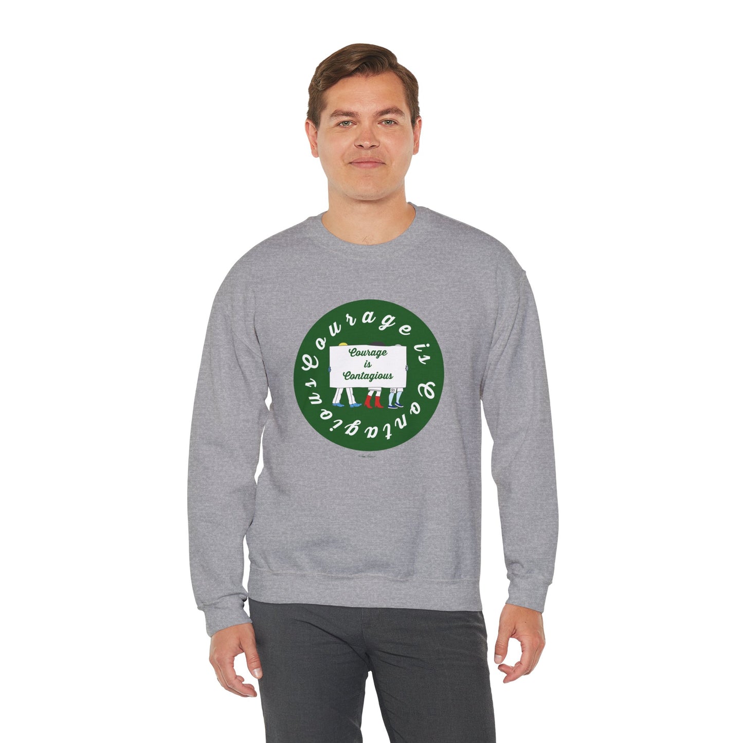 A man wears the Printify Unisex Crewneck Sweatshirt: Courage is Contagious | Protest in light gray, featuring a circular green and white front graphic saying "Courage is contagious"—ideal for fans of inspirational apparel.