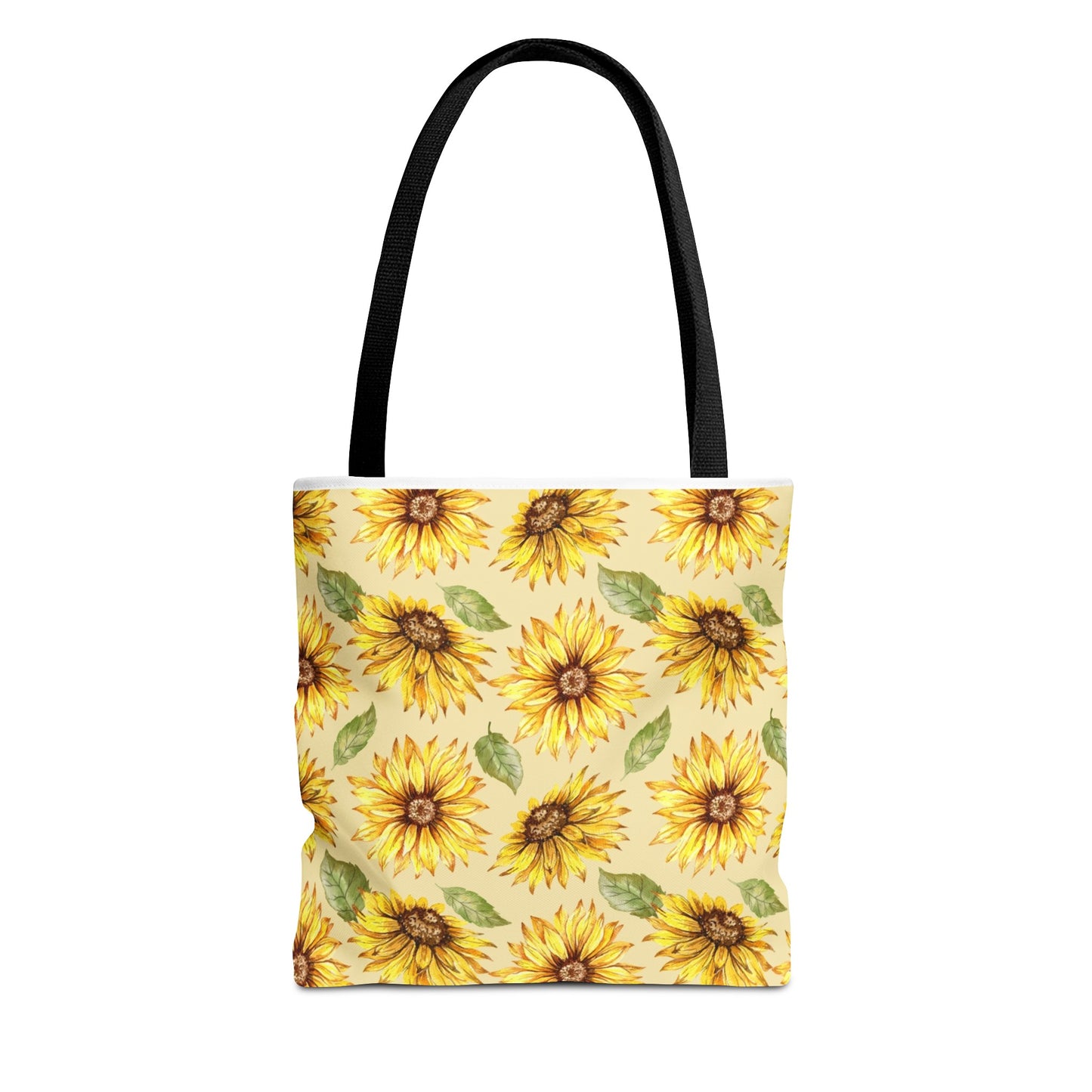 A Printify polyester tote bag with a Yellow Floral pattern featuring sunflowers on a yellow background, and black handles.