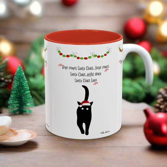 Printify's Santa-Claws Coffee Mug is perfect for cat lovers, featuring a black cat wearing a Santa hat. The red interior enhances the playful text: "Here comes Santa Claws...right down Santa Claws Lane," making it an ideal choice for holiday gift exchanges. Available in two ceramic sizes, it's a delightful cat design gift.