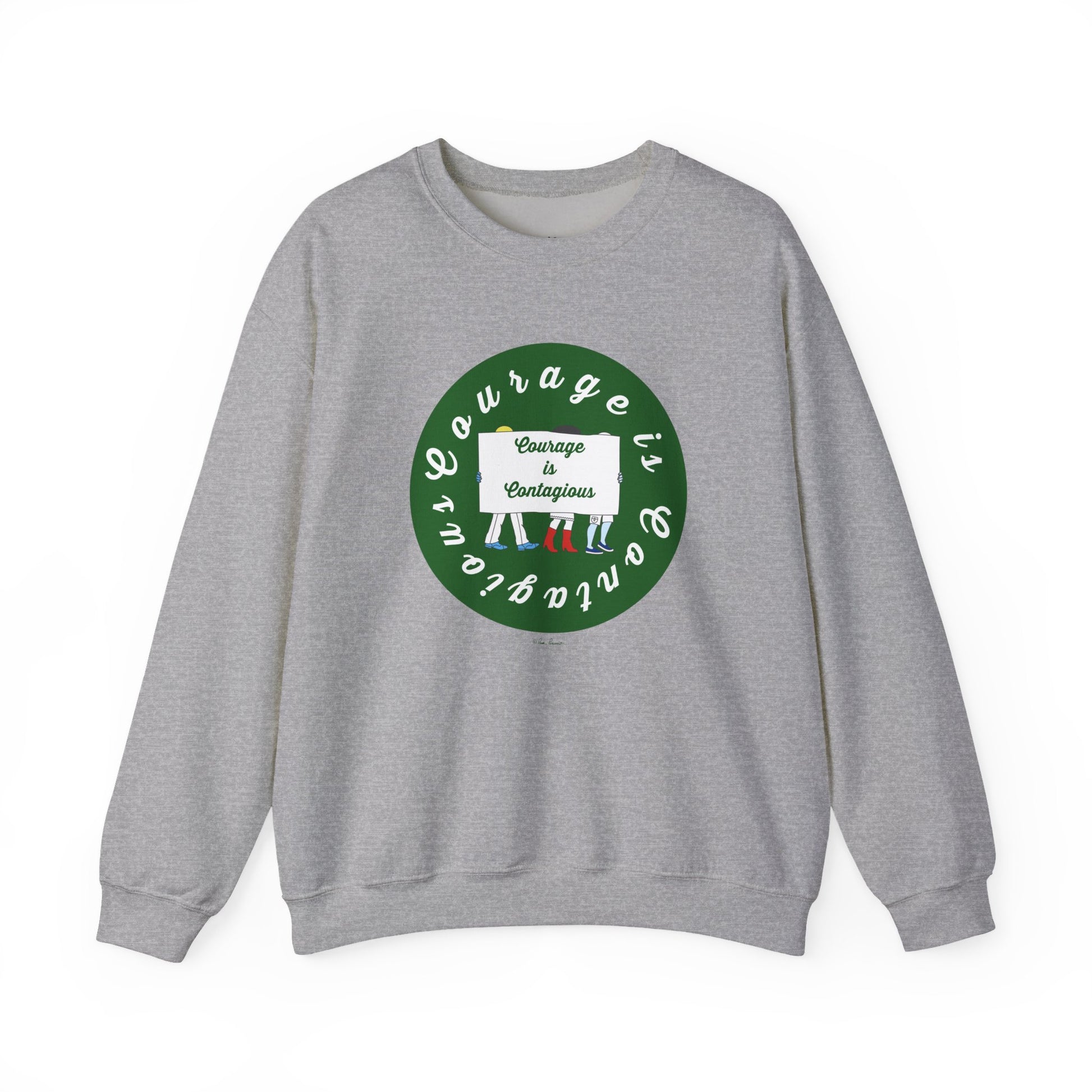The Printify Unisex Crewneck Sweatshirt: Courage is Contagious | Protest features a gray design with a green circle and uplifting text, styled here with multicolored striped socks for an inspirational look.