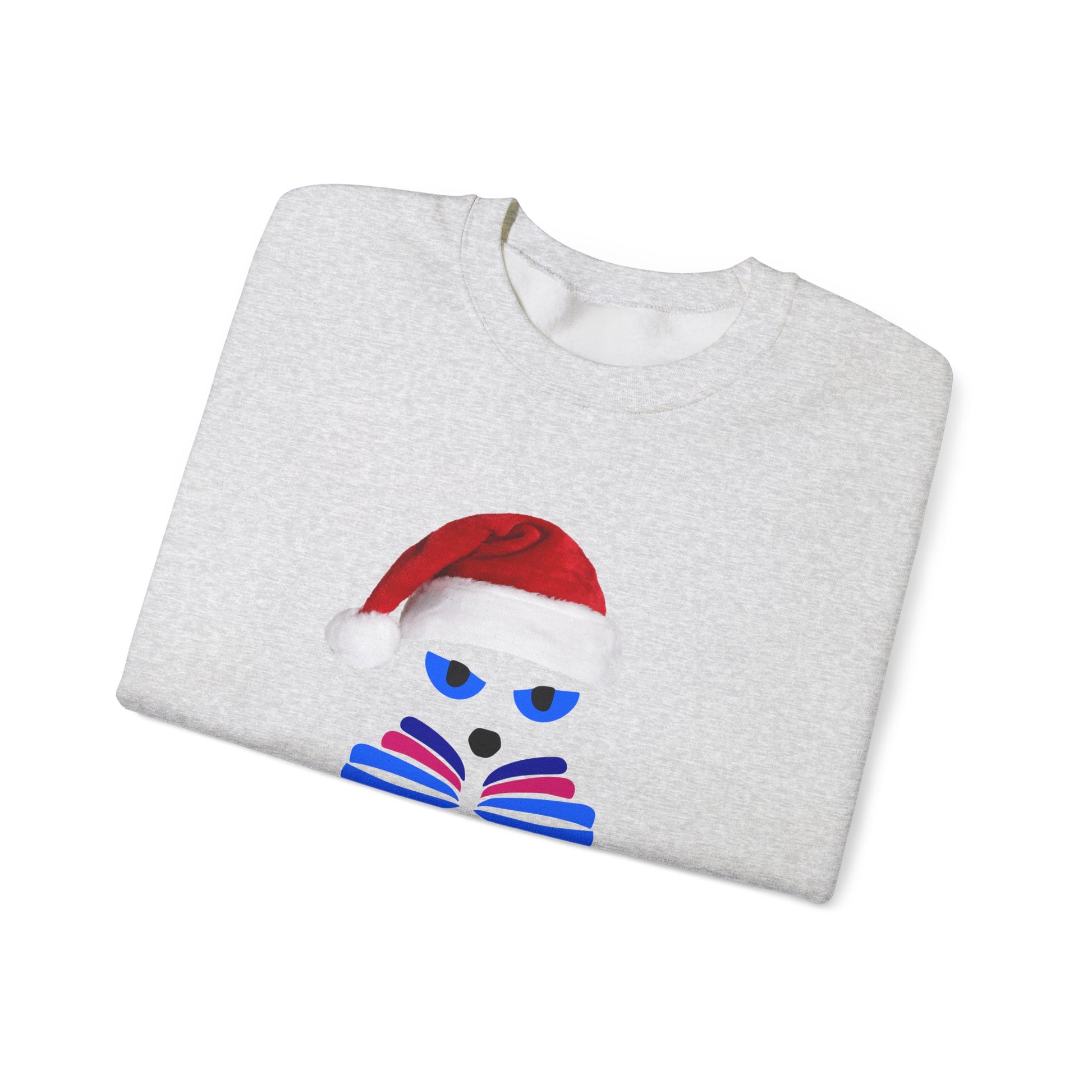 The Santa Cat Sweatshirt by Printify is a folded light gray unisex crewneck featuring a festive graphic of a cartoon cat face with a red Santa hat and blue sunglasses.