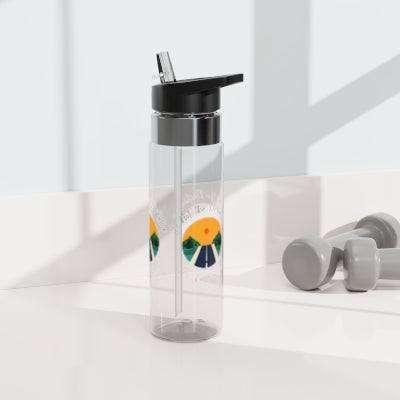 A Printify Unisex Water Bottle: 20 oz.; BPA-free; Kensington Tritan™ with a straw and fruit slices design next to a pair of gray dumbbells on a sunny surface.