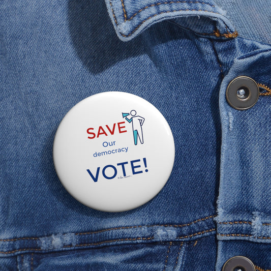 A white Election Vote-reminder Button from Printify, pinned to a denim jacket, displays the text "SAVE our democracy VOTE!" in red and blue. These lightweight and durable metal buttons come in three sizes and feature safety pin backing for secure attachment, serving as a crucial reminder to vote.