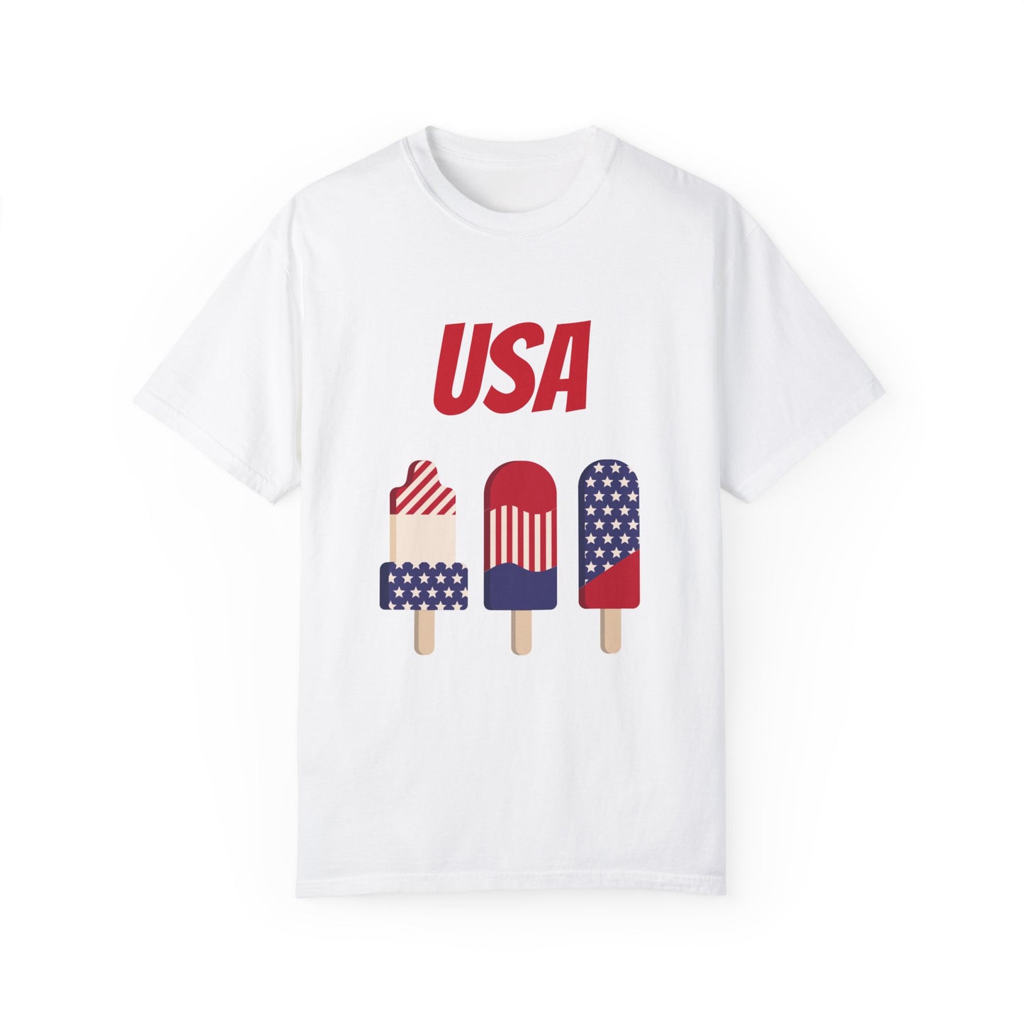 Printify Unisex USA T-shirt: 3 colors; Cotton; Comfort Colors 1717 crafted from 100% ring-spun cotton. This white tee features "USA" text and three popsicles below, each decorated in red, white, and blue colors resembling the American flag. Comfort Colors for ultimate softness and durability.