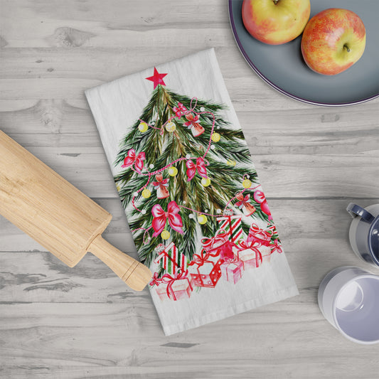 A festive touch is added by a Printify Christmas-Tree Kitchen Towel, size large at 28" x 28" and made of cotton, resting on a wooden surface, surrounded by a rolling pin and a plate of apples, creating the perfect holiday décor scene.