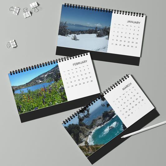 The Printify 2026 Scenic-Landscapes Desktop Calendar features 12 months of beautiful landscape photos in a spiral-bound design, perfect for your desk. Displayed with binder clips and a pen, it's your ideal desktop calendar solution.
