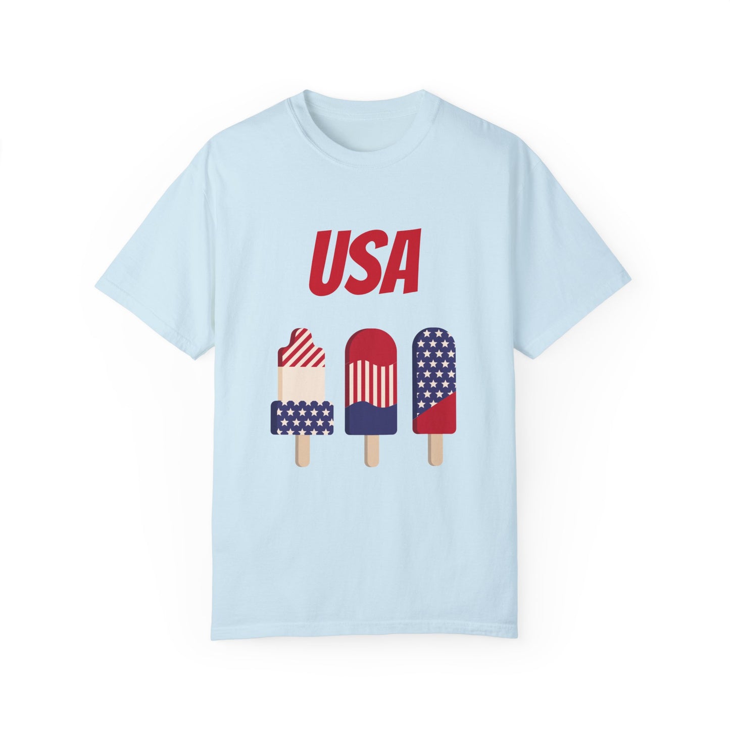 This Printify Unisex USA T-shirt: 3 colors; Cotton; Comfort Colors 1717, made from 100% ring-spun cotton, showcases a light blue hue with striking red "USA" text and three popsicles adorned in American flag colors and patterns.