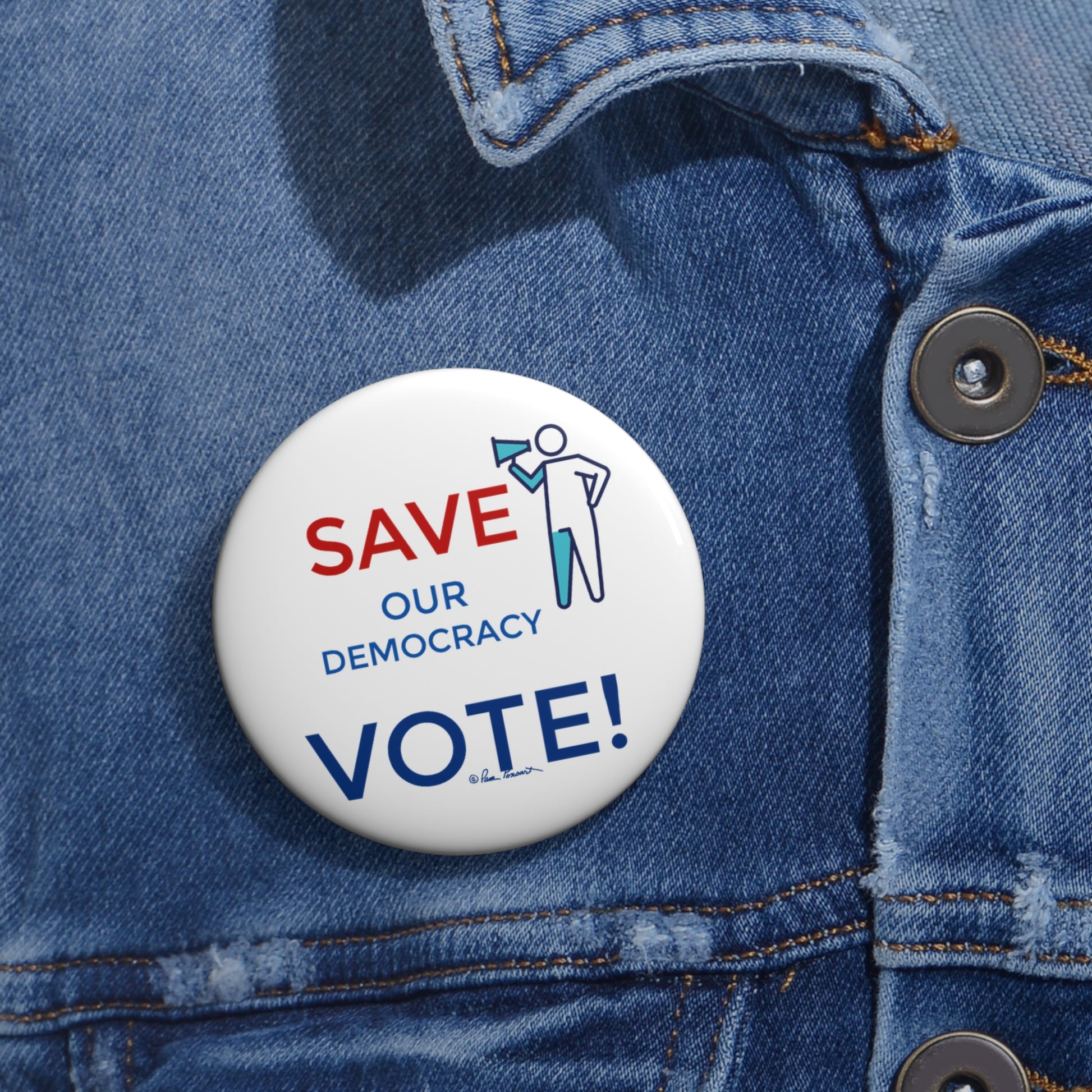 A political accessory pinned to a denim jacket reads, "Save Democracy VOTE!" with an illustration of a person holding a megaphone. This pin is part of the Election Pin Buttons collection by Printify and comes in 2 sizes.